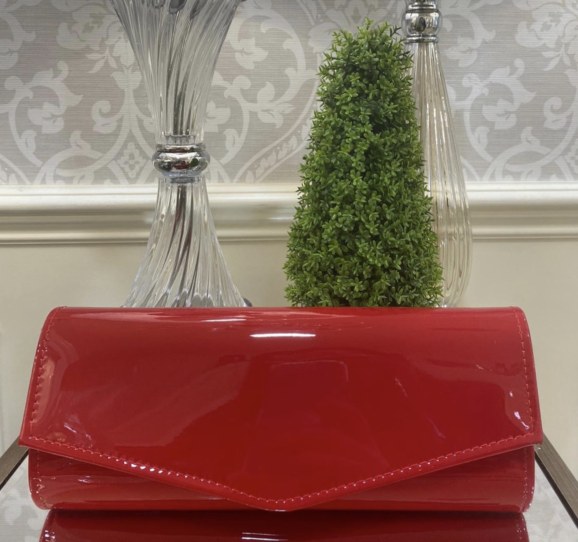 red patent clutch bag