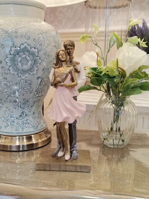 Juliana Embracing Couple with Heart Figurine