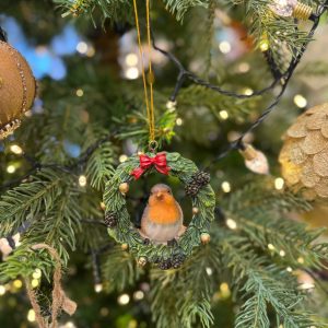Bird Sitting in Hanging Christmas Wreath Decoration